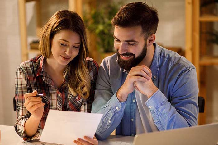 Image of a couple reviewing their finances