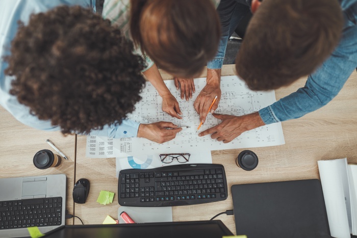 A group of employees looks over their options