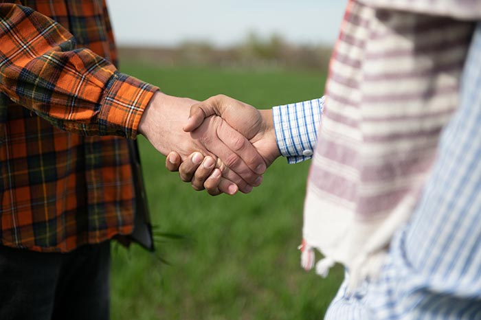 Two farmers shaking hands