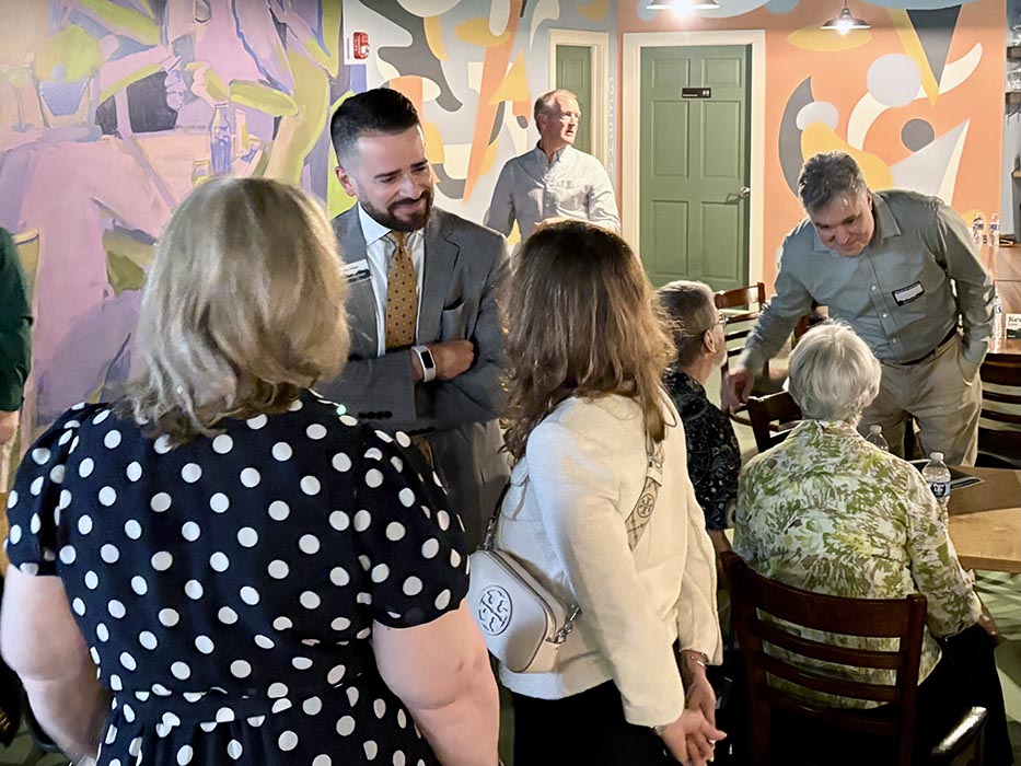President/CEO Chris Gomez speaks with members at the HFCU Annual Meeting