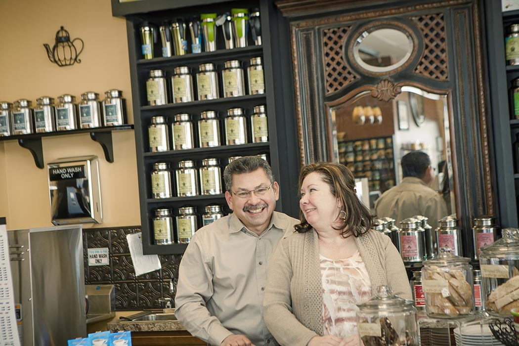 Couple working in the cafe they own